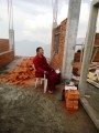 Khenpo Namgyal doing prayers at tje construction place